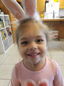Picture of girl wearing bunny ear headpiece.
