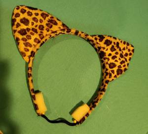 Leopard ear headband with elastic and foam attached.